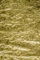 textured background, yellow shiny paper package abstraction