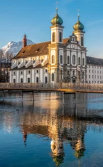 Deurstickers The Jesuit Church of Lucern with Mount Pilatus in the background, Central Switzerland. © Luis