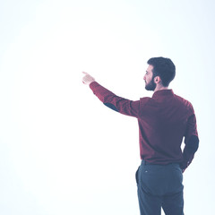 rear view - a successful Manager of a pointing hand on the blank