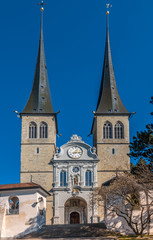 Fototapeta na wymiar The Church of St. Leodegar (Hofkirche St. Leodegar), a Roman Catholic church in the city of Lucerne, Switzerland. Built on the foundation of the Roman basilica during the Thirty Years War.