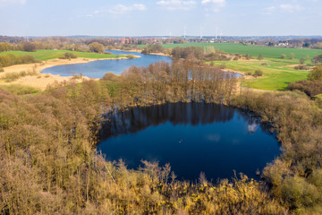 Drone photo of a green lake landscape in spring