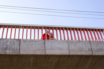 Woman and dog on the bridge