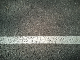 Fototapeta premium Asphalt. Asphalt coating with white tape. Road.