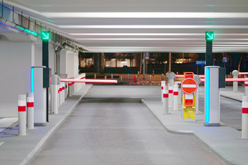 Barrier at Entrance and exit of a car Parking garage. barrier in a car park. Exit from underground parking. Underground parking/garage. Interior of parking