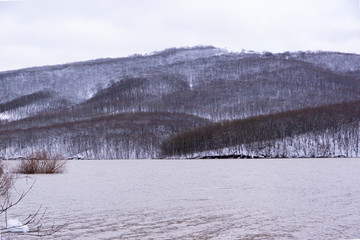 winter landscape with lake and snow