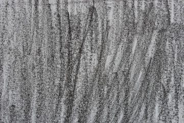 black crayon lines on gray paper background texture