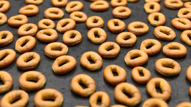 camera moves over a set of round buns spread out on a black table