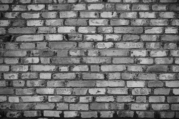The brick texture, wall, with cracks and scratches can be used as a  background, web banner with space for text