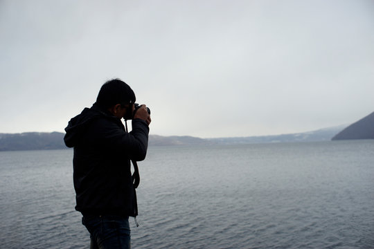 The young man took the photos with a camera at the Lake, bought new.