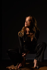 Surrealist portrait. Dramatic portrait of a girl in the dark. Fashion sexy girl. ..