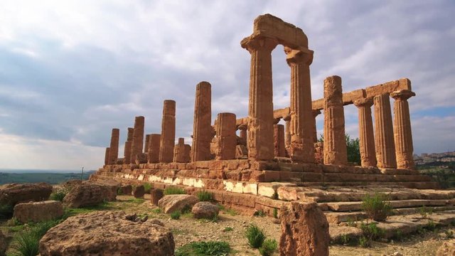 Panning view of Greek temple of Juno in the valley of temples in Sicily before sunset