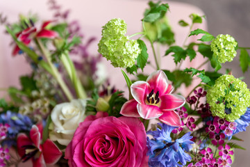 Beautiful bouquet of bright flowers in basket