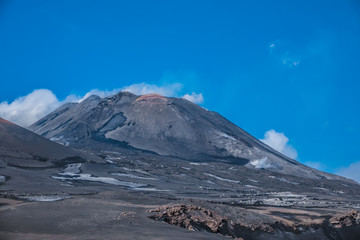 Fototapeta na wymiar Mount Etna, an active stratovolcano on the east coast of Sicily, Italy, in the Metropolitan City of Catania. One of the world’s most active volcanoes, in an almost constant state of activity.