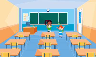 happy little school interracial girls in the classroom