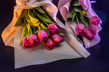 Bouquet of spring tulips on dark wooden background