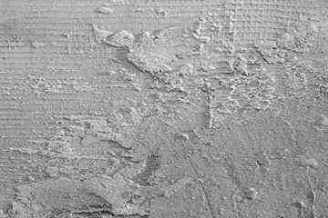 Abstract gray background. White plaster on the wall. Background texture