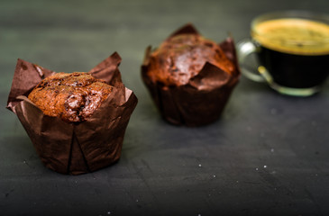 Homemade delicious chocolate muffins with coffee makar