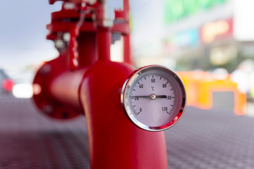 Equipment of the boiler-house, - valves, tubes, thermometer close up