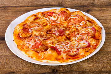 Pepperoni pizza with sausages
