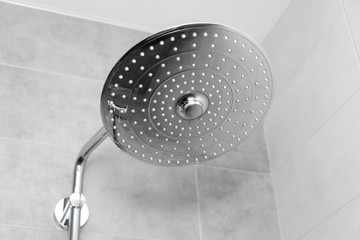 Rain Shower turned off, ceiling shower head closeup in the shower stall.