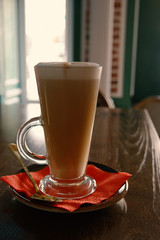 Closeup of latte cup on red napkin