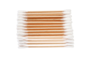 Eco-friendly materials. Wooden, cotton swabs on a white background
