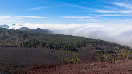 Remarkable ornographic waterfall clouds spilling over the leeward slope of mountains on northern Tenerife.
