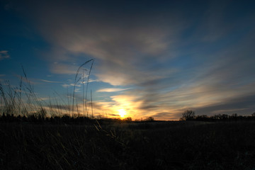 Sunrise over prairie landscape