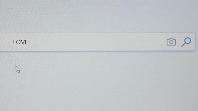 Internet user writes the word love in the search bar.Browser search bar.