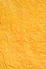 orange color painted crinkled paperas background