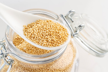 amaranth beans in spoon and glass bowl