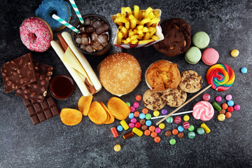 Obraz na płótnie Canvas Unhealthy products. food bad for figure, skin, heart and teeth.