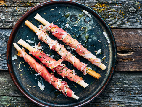 Homemade Italian Snack Grissini With Prosciutto In Plate Top View