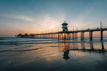 Sunset reflections and the pier in Huntington Beach, Orange County, California