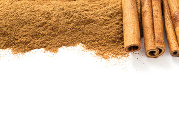 Ceylon cinnamon sticks and ground cinnamon on a white background