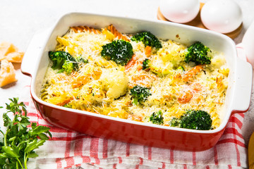 Casserole from pasta and vegetables in baking dish.