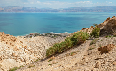 shulamit spring sits high up the rugged desert mountains above ein gedi at the  dead sea in israel