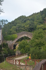 Wonderful Medieval Style Bridge Crossing The Suarna River On Its Pass By Navia De Suarna. Nature, Architecture, History, Street Photography. August 23, 2014. Navia De Suarna, Lugo, Galicia, Spain.