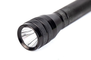luminous black flashlight isolated on a white background