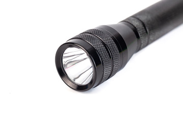 luminous black flashlight isolated on a white background