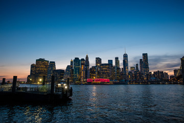 Fototapeta na wymiar View of the Brooklyn bridge during a dusk from East river. New York City