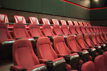 part of a theatre, or similar building, where the people who are watching and listening sit