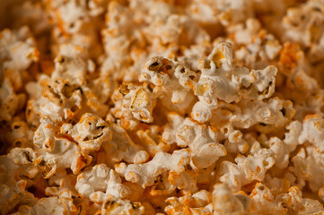 Closeup of popcorn covered in hot sauce