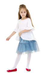 Naklejka premium Little girl ballerina performs dance.