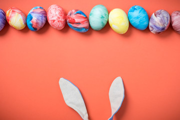 Easter eggs on a Living Coral background. 2019. Easter ideas. Easter eggs. Space for text. Happy easter.