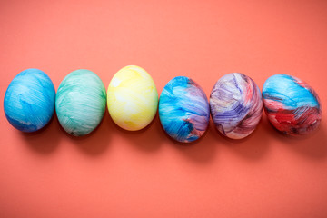 Easter eggs on a Living Coral background. 2019. Easter ideas. Easter eggs. Space for text. Happy easter.