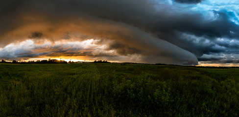 Obraz na płótnie Canvas storm over the field