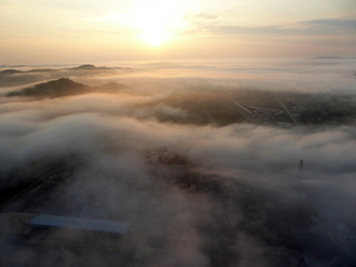 A wet day for the misty rocky mountains covered in snow and surrounded by big thick fog