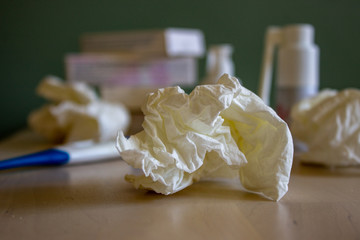 The effects of allergy, colds, asthma. In the background a drug pillar.