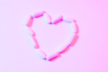 Heart disease medications, Drugs for Heart Disease. Pills background in retrowave rave style